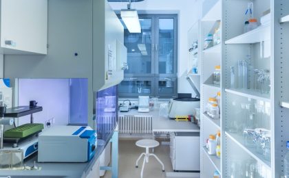 A pristine, sterile laboratory with gleaming surfaces and advanced equipment, symbolizing the controlled environment of CADR testing. This setting contrasts with the real-world effectiveness of Austin Air purifiers, which are clinically proven to improve health outcomes for people with respiratory conditions such as asthma and COPD.