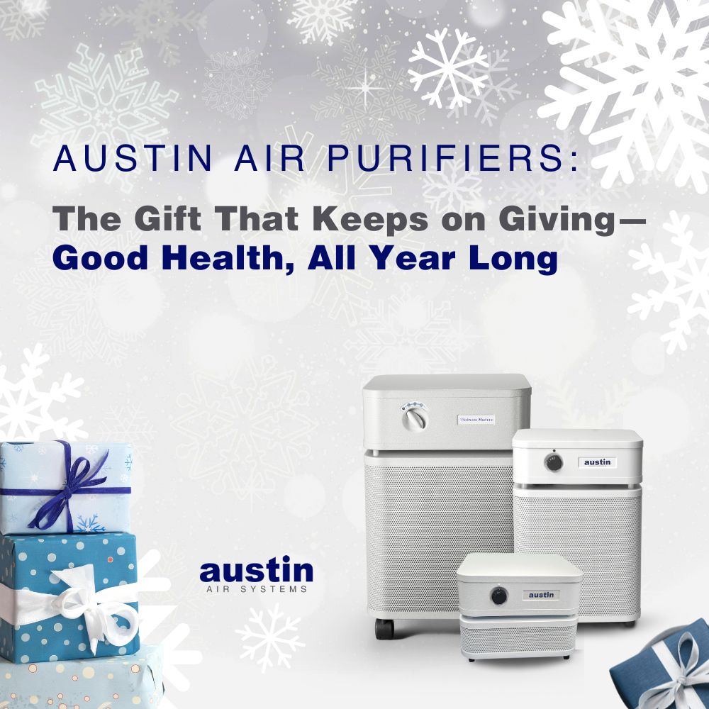 A graphic stating: “Austin Air Purifiers: The Gift That Keeps on Giving—Good Health, All Year Long” The background is light gray, covered with different snowflakes in white. There is a photo of three Austin Air Purifiers in three sizes: Standard, Junior, and the “it” personal air purifier to the right and two wrapped presents in the left corner. The words “Austin Air Systems” and in the bottom, toward the center left in royal blue and dark gray.