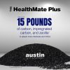 gray background with an image of a pile of black carbon with blue text that reads: The HealthMate plus uses up to 15 pounds of carbon, impregnated carbon, and zeolite to absorb the chemicals in wildfire smoke